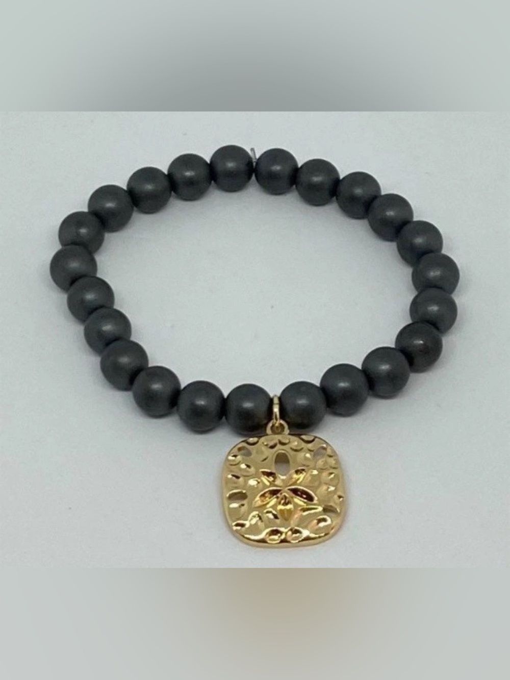 Gold Sand Dollar Charm Bracelet with gray Beads